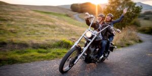 Happy couple riding a motorcycle